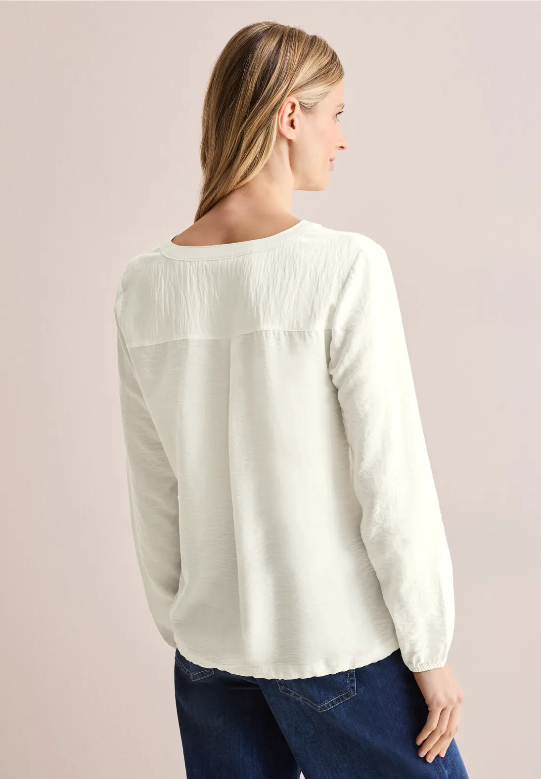 BLUSA MONOCOLOR CON CORDON EN DOBLADILLO