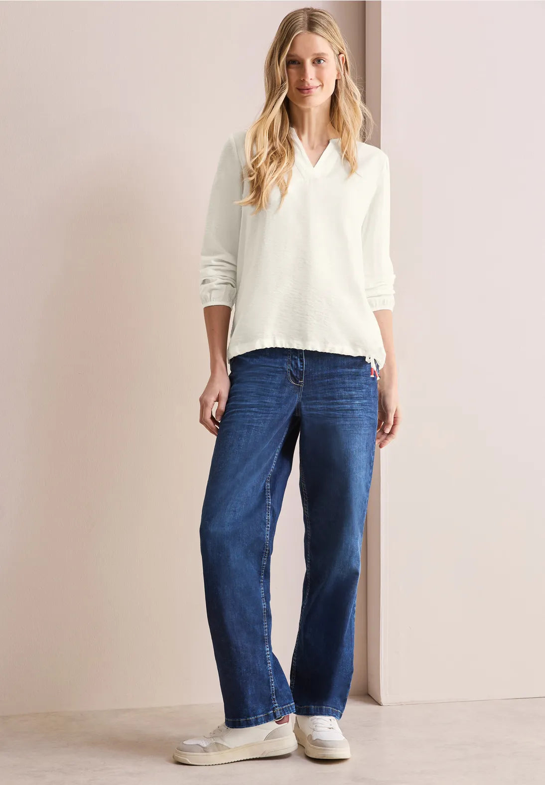 BLUSA MONOCOLOR CON CORDON EN DOBLADILLO