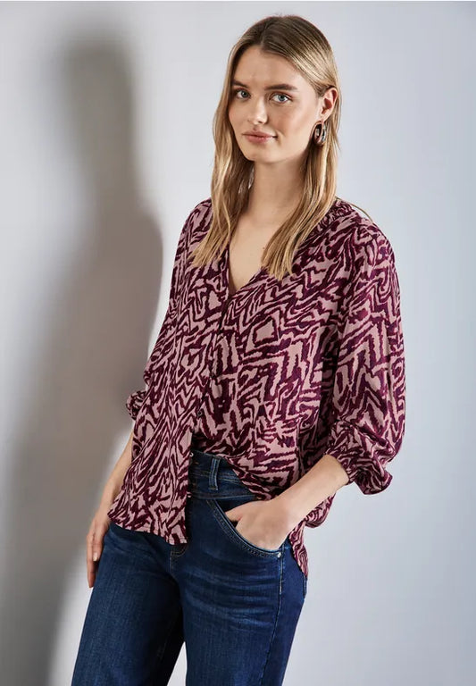 BLUSA ESTAMPADA PUÑOS ELASTICOS