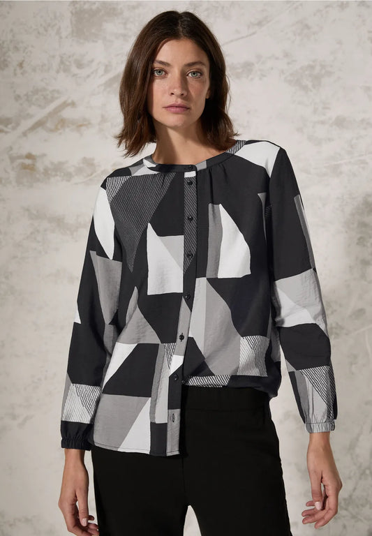 BLUSA ESTAMPADA Y CUELLO REDONDO